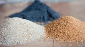 Different silica sand sizes displayed in layers from coarse to ultrafine