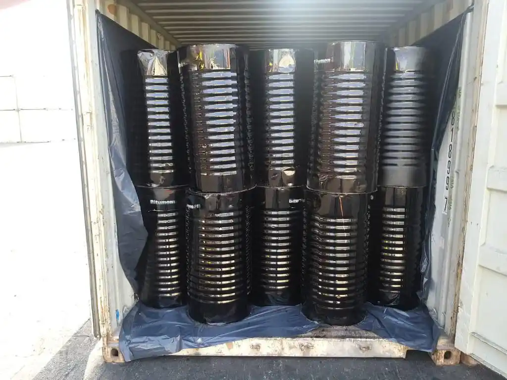 Stacked steel drums of Bitumen A-P1 polymer modified bitumen ready for export in Dubai warehouse