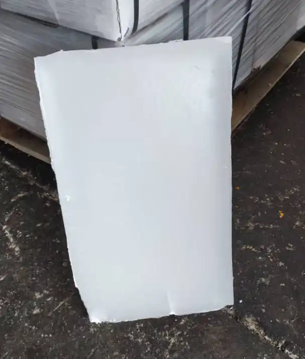 Fully refined paraffin wax slab 58-60°C used for candle making, food packaging, cosmetics, and industrial applications.