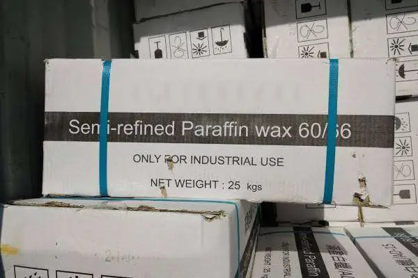 Semi refined paraffin wax 5–7% oil content packed in 25 kg cartons for industrial use.