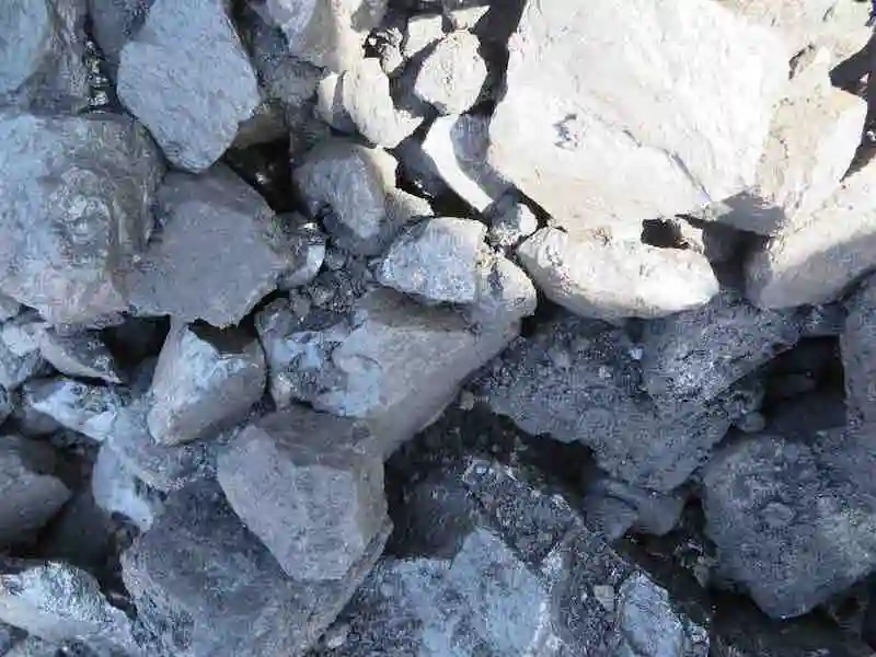 Natural amorphous graphite lumps used for steelmaking, friction products, and industrial applications.