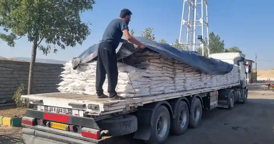 Oxidized Bitumen 75/25 loaded on a flatbed truck and covered for export by ATDM.
