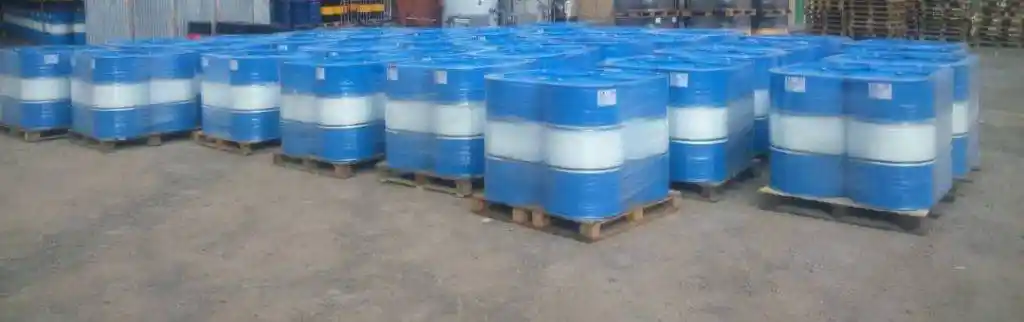 Bitumen MC250 packed in blue and white steel drums on pallets ready for export.