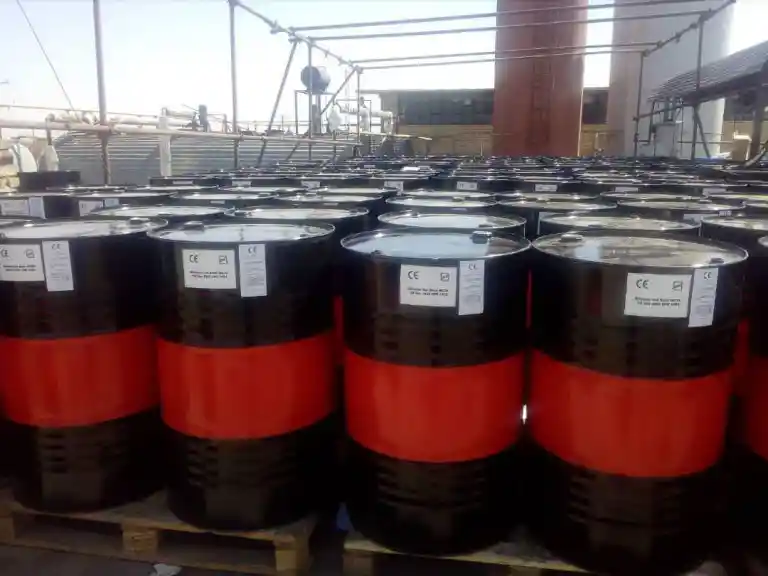 Bitumen SC70 packed in red and black steel drums on pallets ready for export by ATDM.