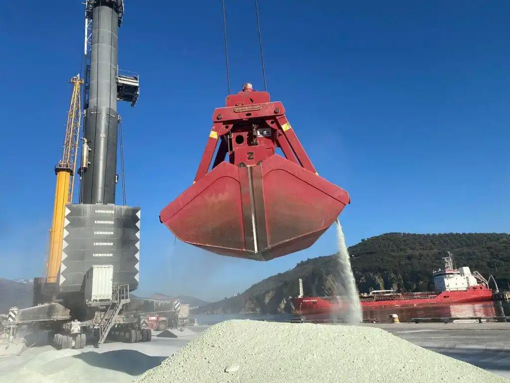 Bulk cement clinker loading at port — high-quality clinker exported for cement production worldwide.