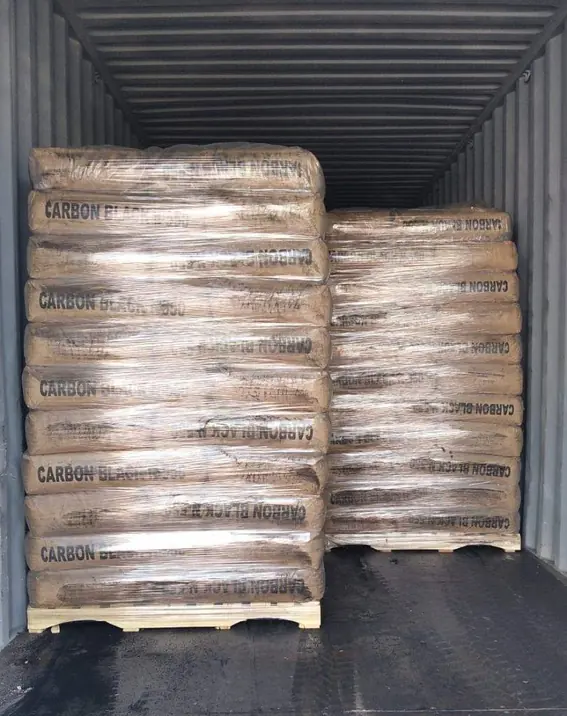 Carbon Black N234 bags stacked on pallets in export container by ATDM.