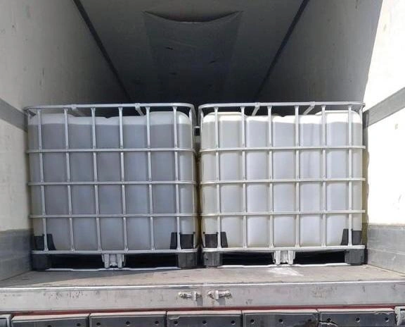 Liquid Calcium Bromide solution in IBC tanks ready for export — used as completion and workover fluid in oilfield drilling.